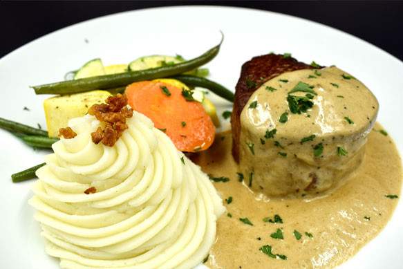 filet mignon with mashed potatoes and steamed vegetables